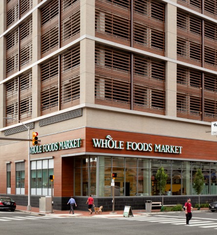 Exterior modern Whole Foods Market storefront on city street corner