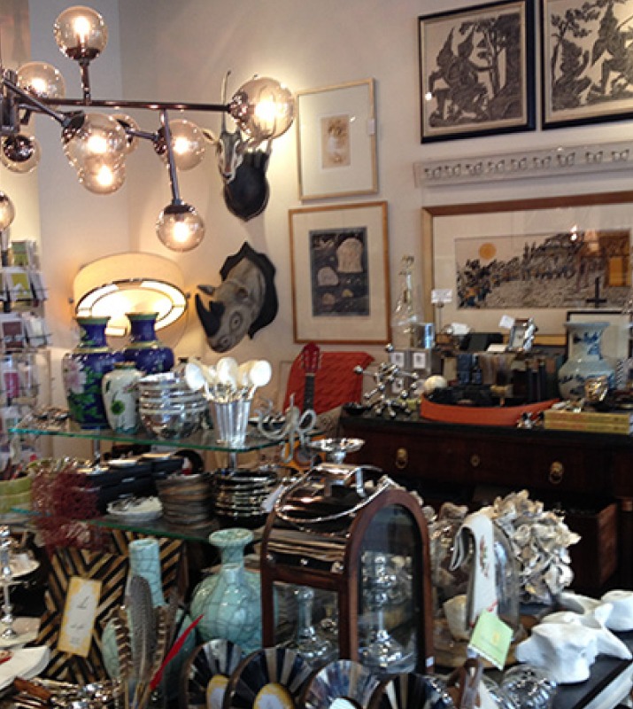 Closeup of various trinkets and home decor items on display inside store Curiosity