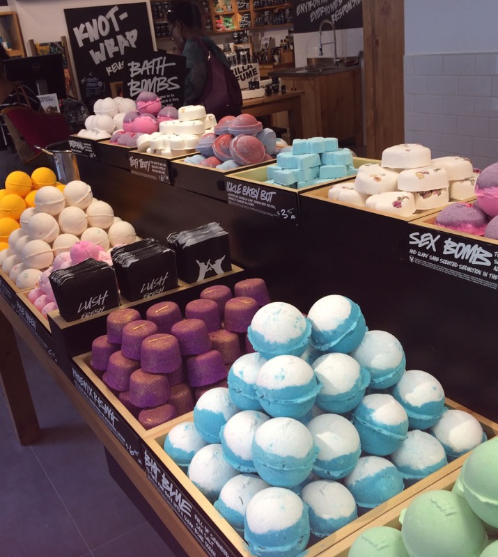 Towers of bath bombs displayed in containers inside of Lush in Harbor East