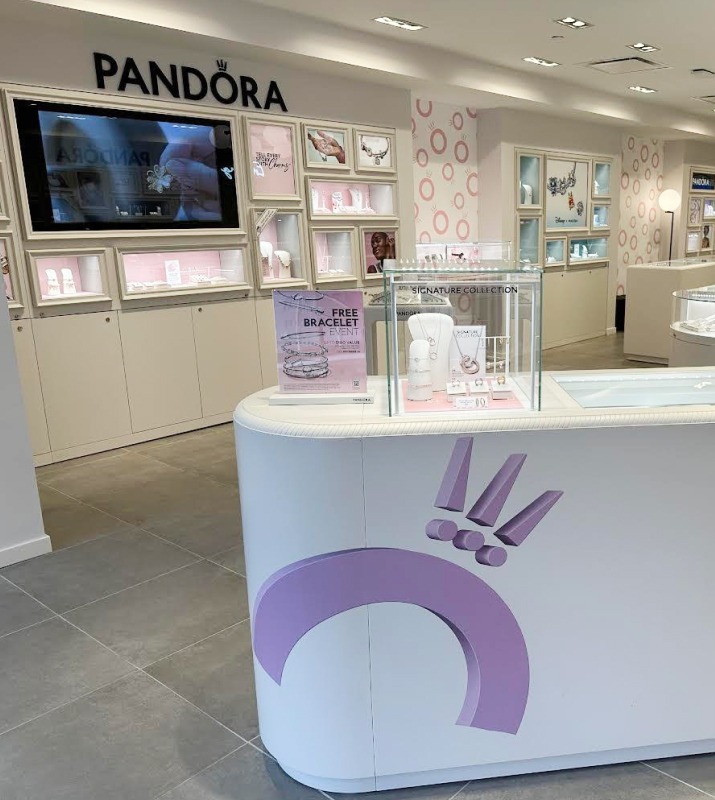 High end jewelry displayed across a bright, clean room at Pandora in Harbor East
