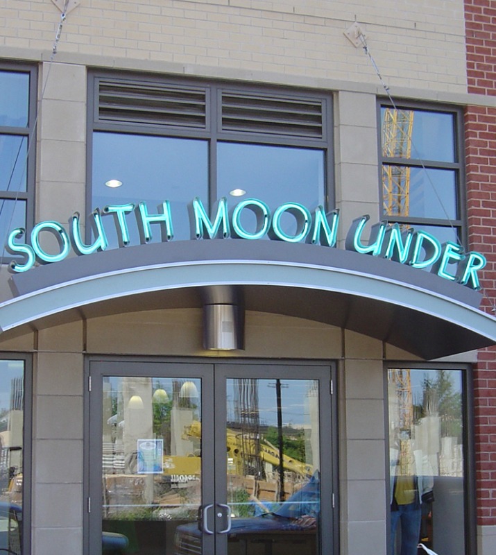 Brightly colored entrance to South Moon Under, a clothing retailer in Harbor East