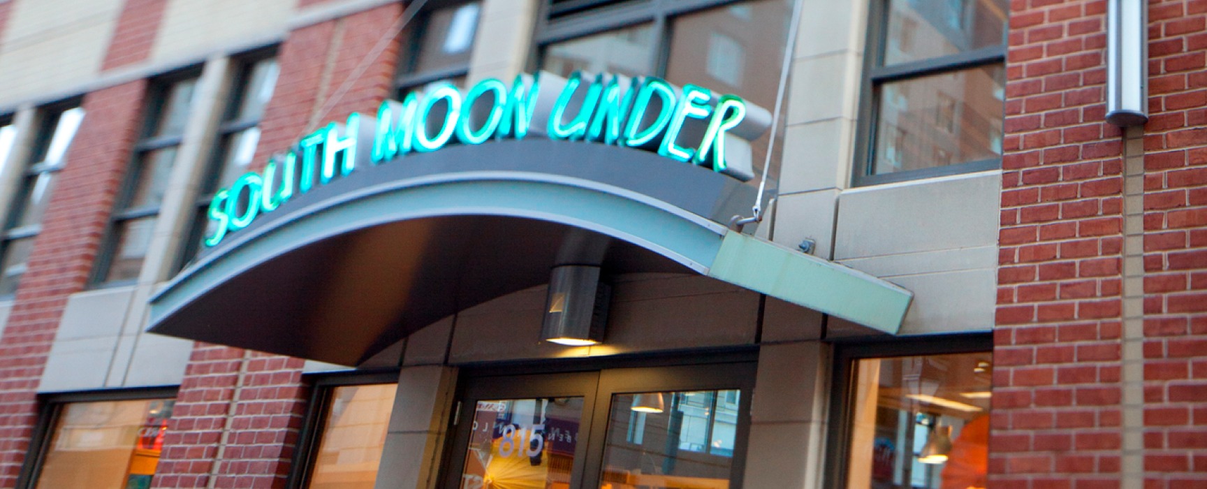 Brightly colored entrance to South Moon Under, a clothing retailer in Harbor East