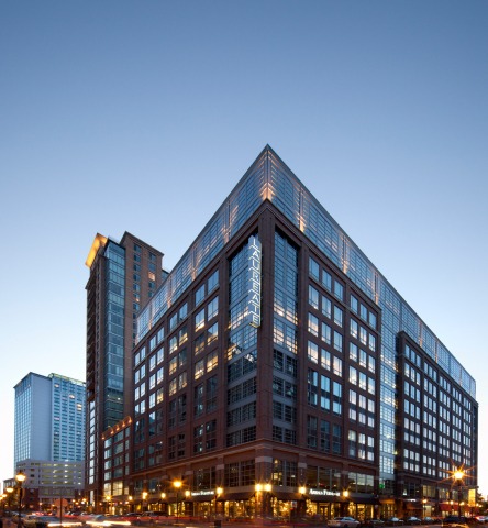Sunset at 650 S Exeter - a large glass office building in Harbor East