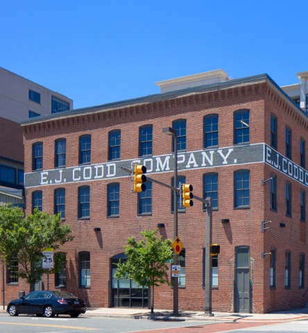 EJ Codd office building, a historical brick structure, on a sunny day in Harbor East